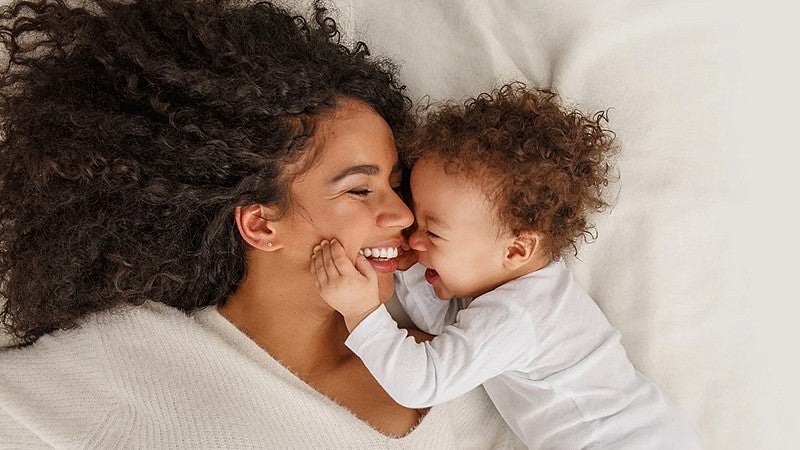 mother and baby laying down together